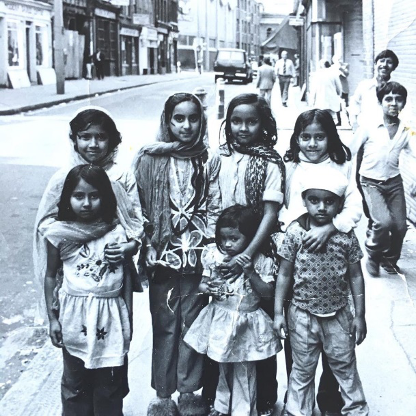 Photograph of a group of children on a road in East London.