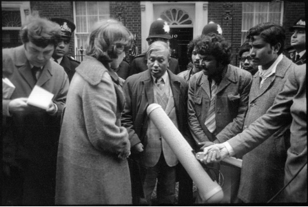 Photograph of a group of people in front of 10 Downing Street.