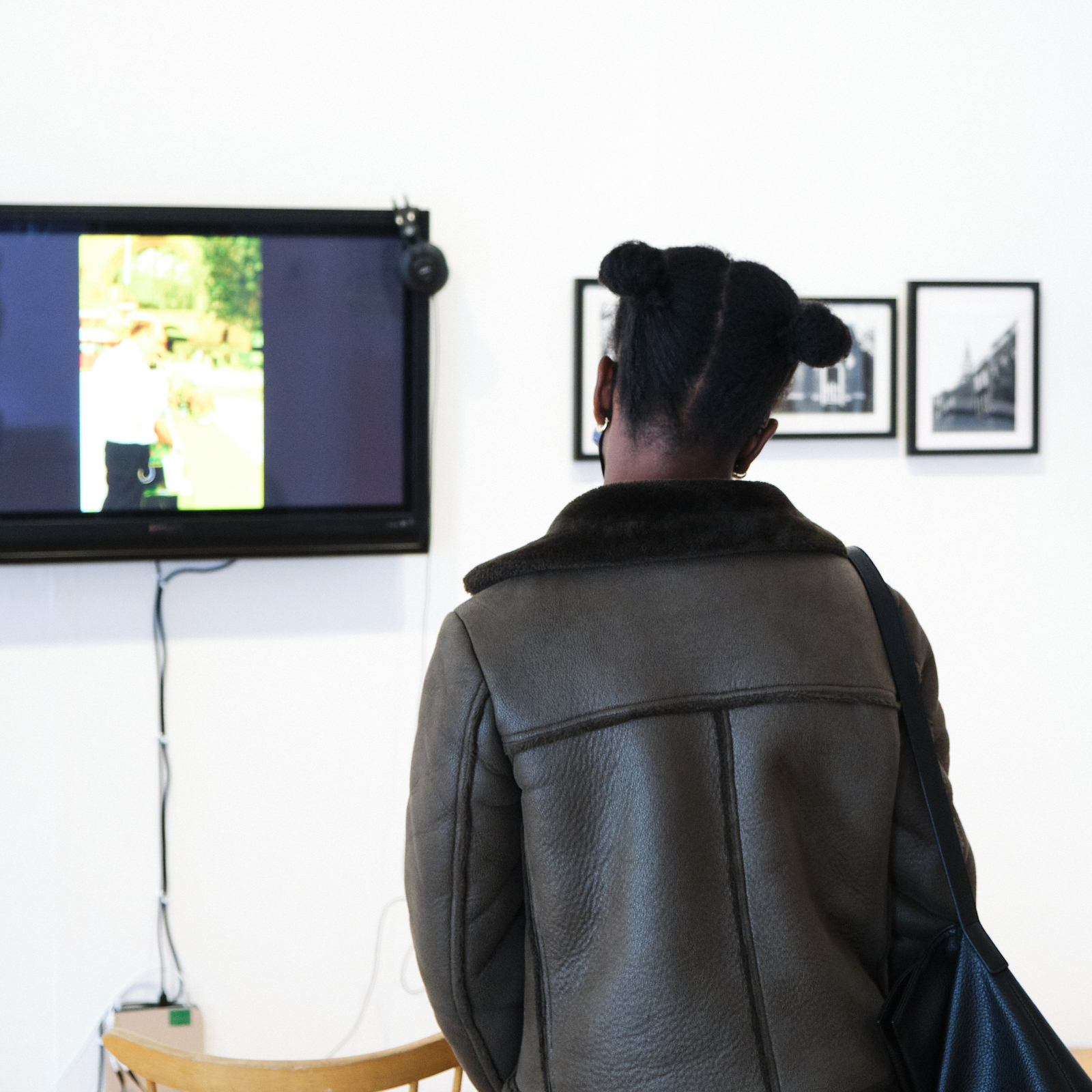 People looking at photography in a gallery.